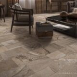 Elegant living room with vinyl flooring resembling natural stone and modern rustic decor